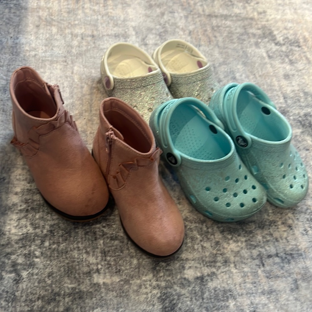 Kids crocs and pink booties.